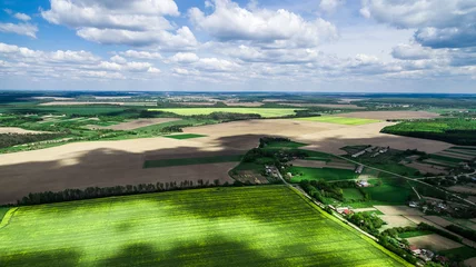 Fotobehang beautiful landscape with shade of clouds on the field, aerial photo © Ievgen Skrypko