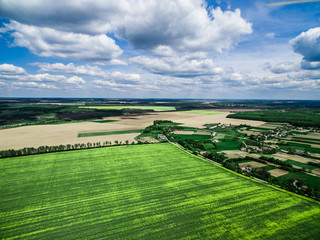 beautiful green field with village, view from height