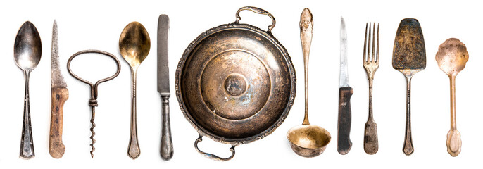Collection of different antique kitchen utensils on white background