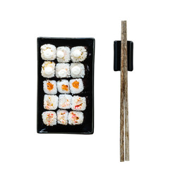 assorted sushi on black plate with chopsticksisolated on a white background