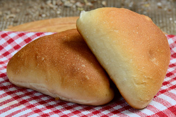 Pasties stuffed meat on a dark wood background, selective focus