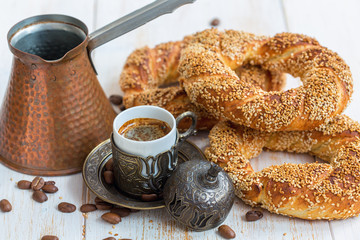 Breakfast with black coffee and Turkish bagels.