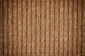Brown bamboo straw mat for background and texture
