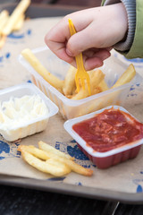 Little girl eating french fries