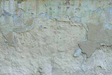 Wall fragment with scratches and cracks