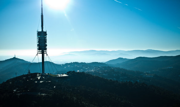 View of TV-tower in Barcelona in the background of blue mountains
