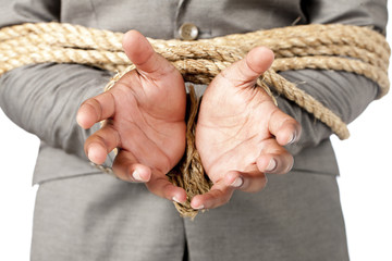 businessman hands tied up with rope