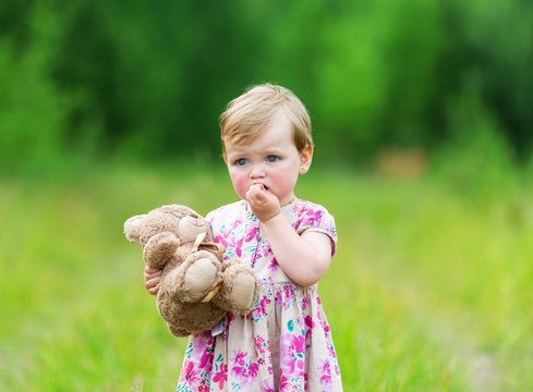 Little girl and bear Teddy.