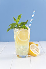 Lemonade with mint leafs and lemons.