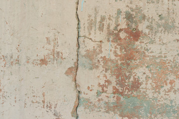 Wall fragment with scratches and cracks