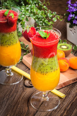Smoothies with fresh fruit. Strawberries, apricots, kiwi.