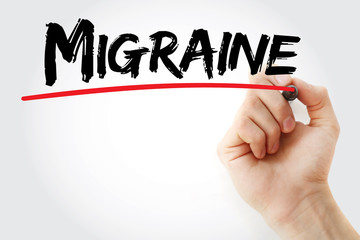 Hand writing Migraine with marker, health concept