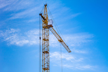 Crane against the blue sky.