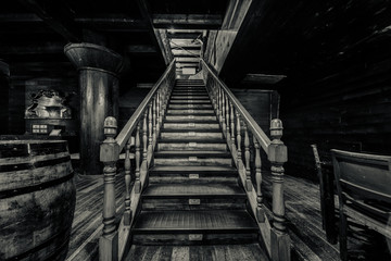 Wooden staircase. Interior of old pirate ship. Black and white 