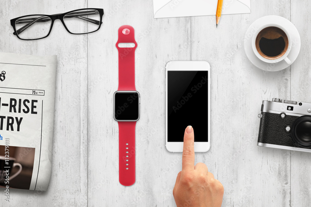Poster smart watch and phone with isolated, blank screen for mockup. top view of table with camera, coffee,
