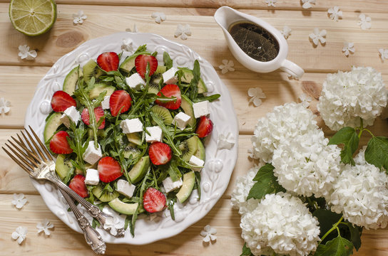 Salad With Avocado Kiwi Strawberry Feta And Arugula  