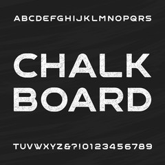 Chalkboard alphabet vector font. Distressed letters and numbers on a chalkboard background. Vector typeface for your design.