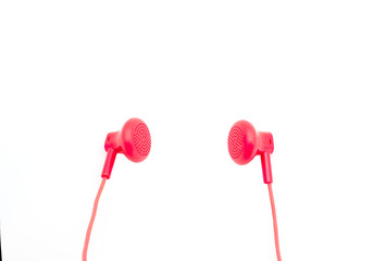 red earphones on white background isolated with path