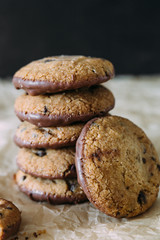chocolate chip cookies with milk on kraft paper