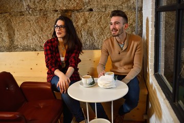 Young couple having coffee in the first date