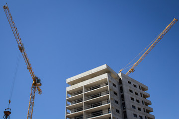 Fototapeta premium Tower cranes on building site