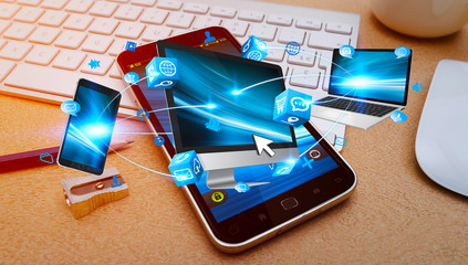 Tech devices connected to each other by mobile phone © sdecoret