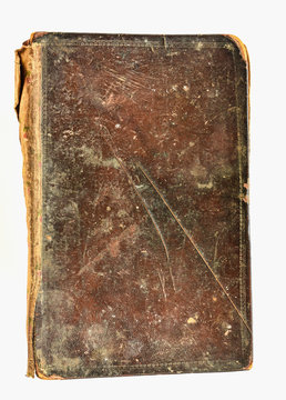 Old note book or diary with brown leather cover on white background.