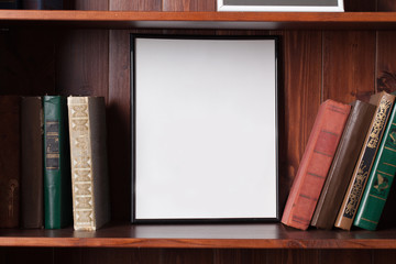 Empty Poster on a book shelf © 4Max