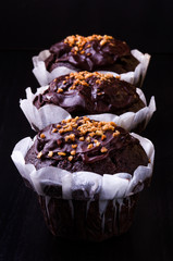 Chocolate muffins on a dark background