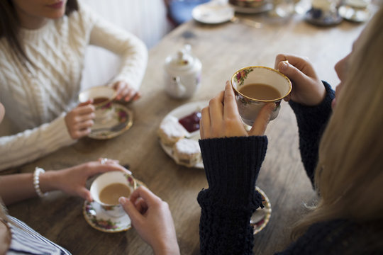 Group Of Young Female Friends Meeting In Tea Shop