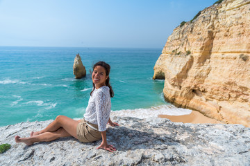Girl at beautiful beach Carvalho of Algarve, Portugal