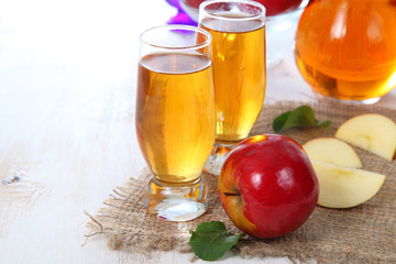 Apple juice and fresh red apples