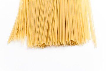 Raw spaghetti on white background.