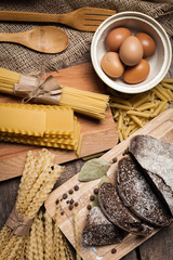 Pasta spaghetti with egg on old wooden background