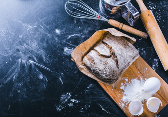 Ingredients and utensil for baking on the black board, top view