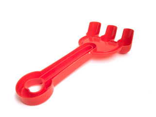 Red fork beach toys isolated on white background. Color toys. Beach toys. Isolated toys.Children toys.