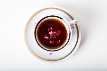 Cup of black tea in a china cup and saucer
