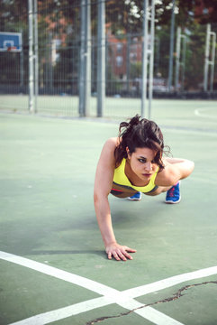 Young Woman working out outdoors and having fun