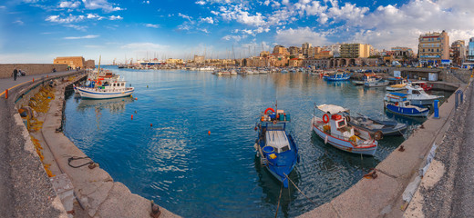 Panorama of Old harbour with fishing boats and marina in the summer sunny morning, Heraklion, Crete, Greece. - obrazy, fototapety, plakaty
