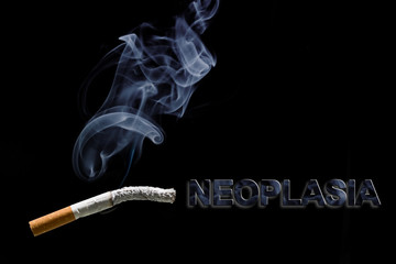 Burned cigarette and text neoplasia