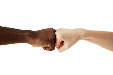 Black African American man touching knuckles with white Caucasian woman in agreement, partnership and cooperation. Two people of different cultures and races greeting each other in modern handshake - obrazy, fototapety, plakaty