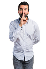 Man making silence gesture