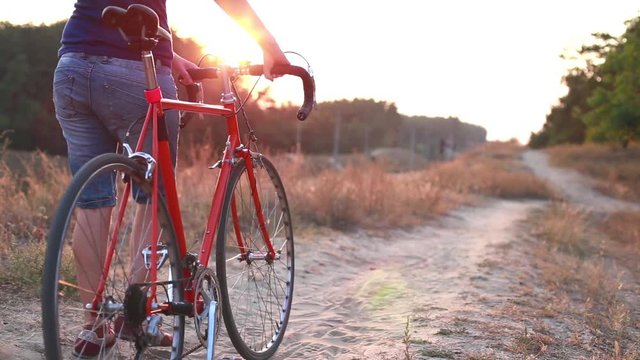 Girl on Bike with Sunset