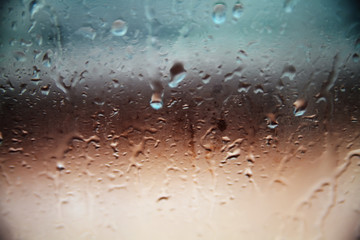 Blurred drops background.Rainy glass.