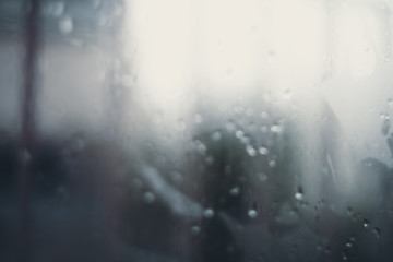 Blurred drops background.Rainy glass.