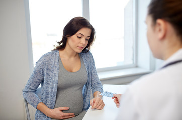 gynecologist doctor and pregnant woman at hospital