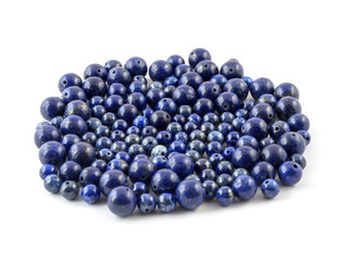 Gemstone natural lapis lazuli on white background, beads