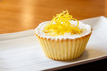 Custard cake with sugar powder and  candied fruits