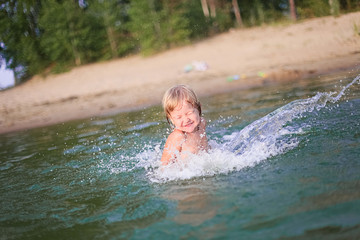 Little girl bathes