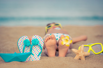 Child relaxing on the beach